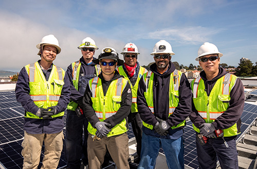 The SFPUC's Utility Field Service all smiles after completing their 8th solar installation at a SFUSD school.