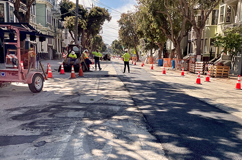Crews repaving Page Street after completing a Small Diameter Sewer Rehabilitation and Renewal (R & R) Program project sewer pipeline replacement.