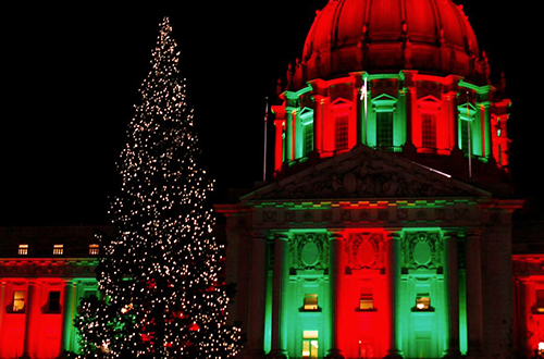 a decorated Christmas tree in front of City Hall