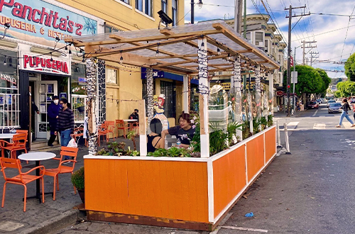 People dine outside of one of San Francisco's parklets.