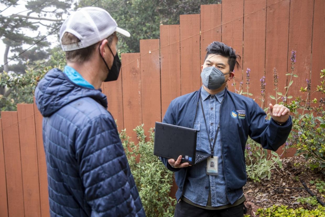 Water Wise Evaluation: Homeowner Peter Monks, left, receives a water wise evaluation from Andrew Ho, right, a Water Service Technician at the San Francisco Public Utilities Commission.