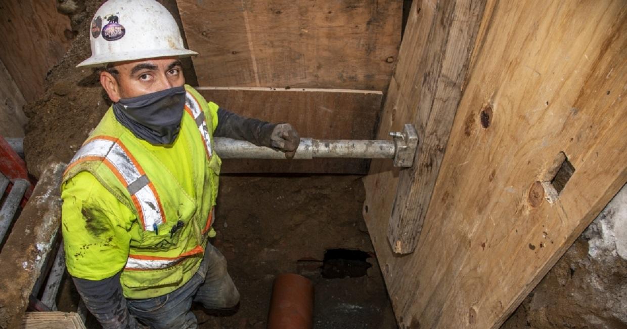 worker inspecting a sewer lateral