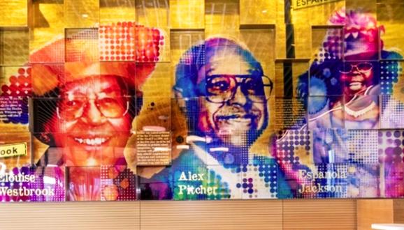 The foyer of the new Southeast Community Center at 1550 Evans Avenue includes a larger-than-life portrait of Alex Pitcher, who led “The Big 6” community activist group that advocated for the original community center.