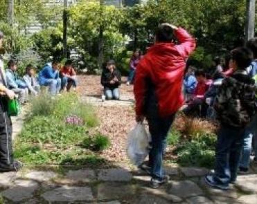 students standing in the learning garden
